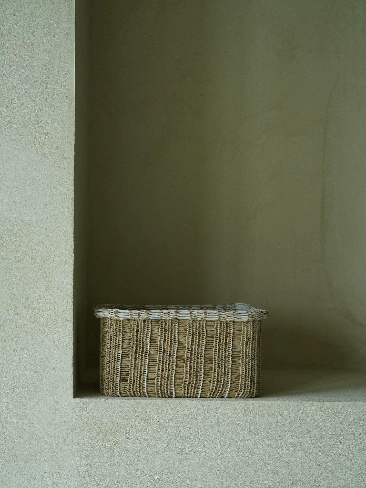 Handwoven storage basket made from natural fibers, eco-friendly organizer for home and office use.