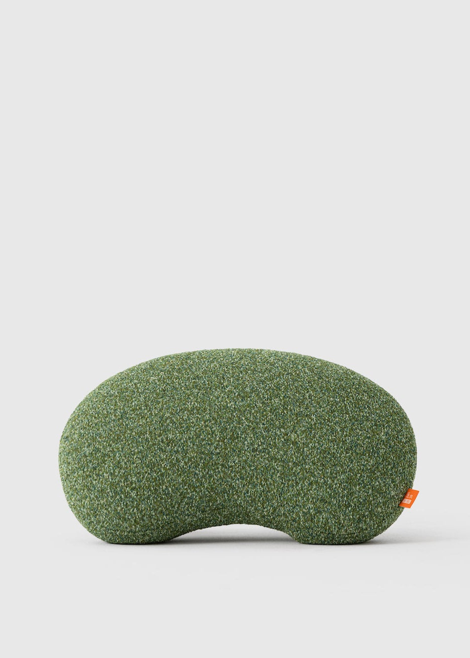 Green sleep eye mask on a light gray background