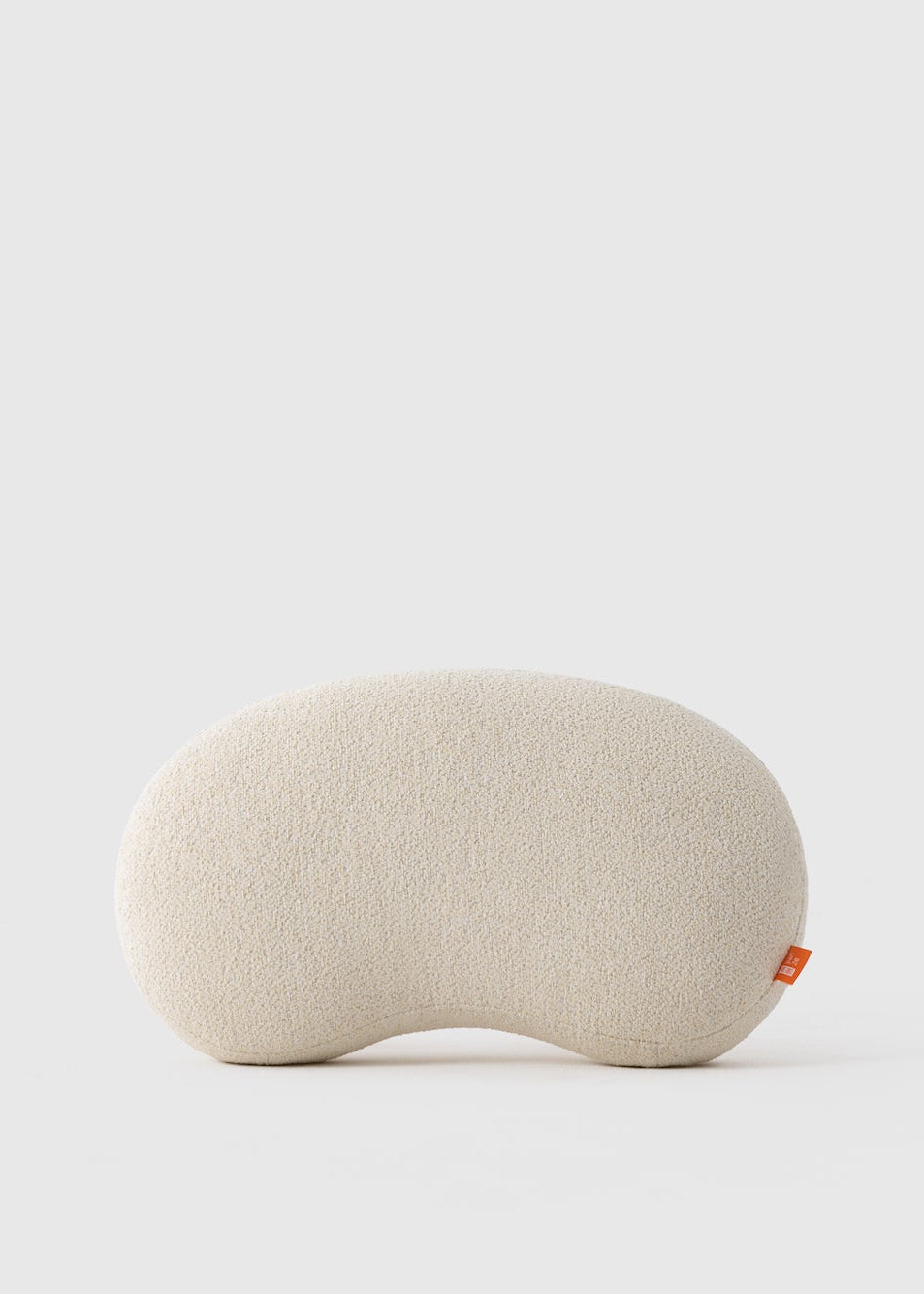 Beige eye pillow on a light gray background