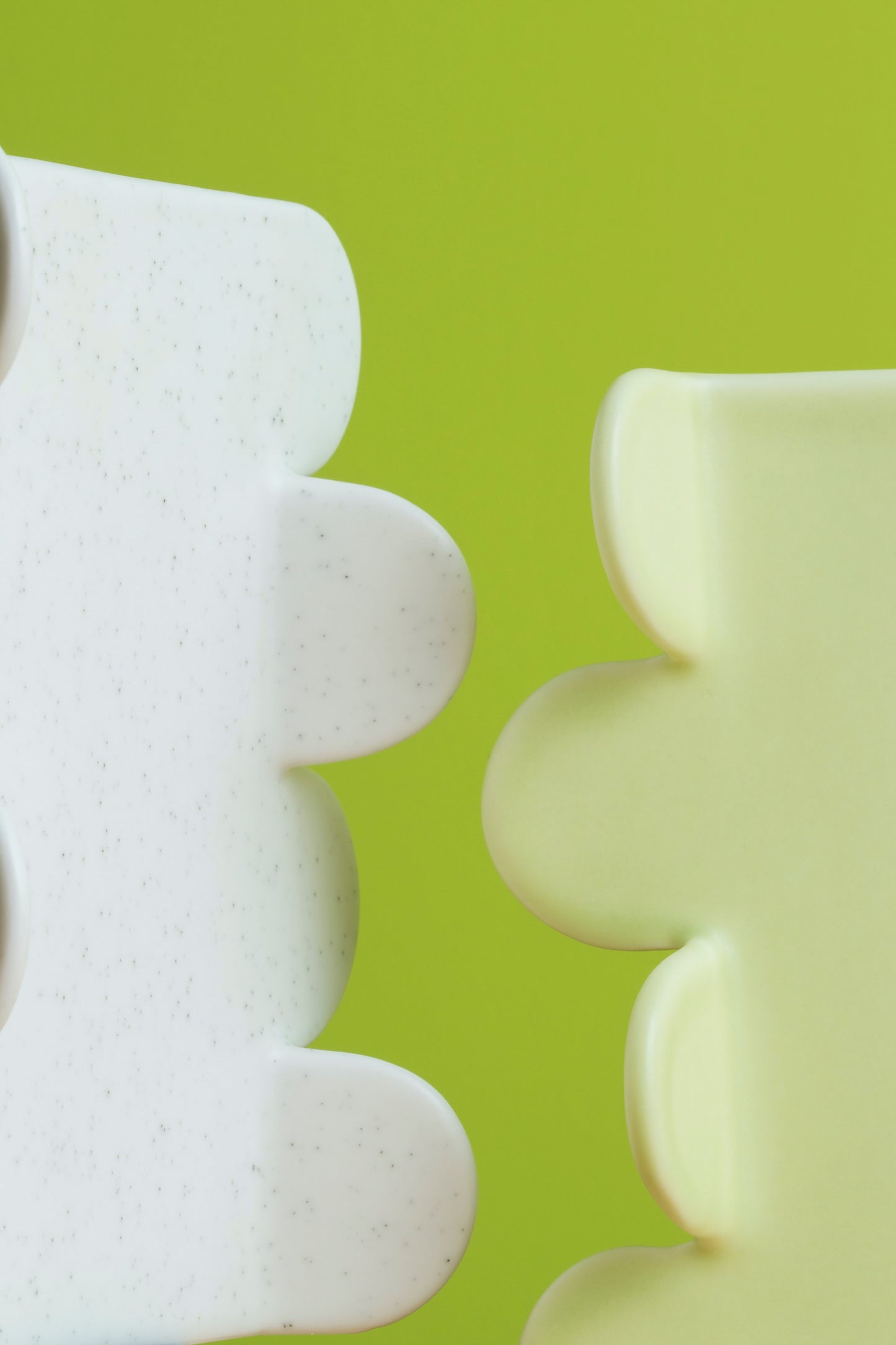 White textured objects on a green background