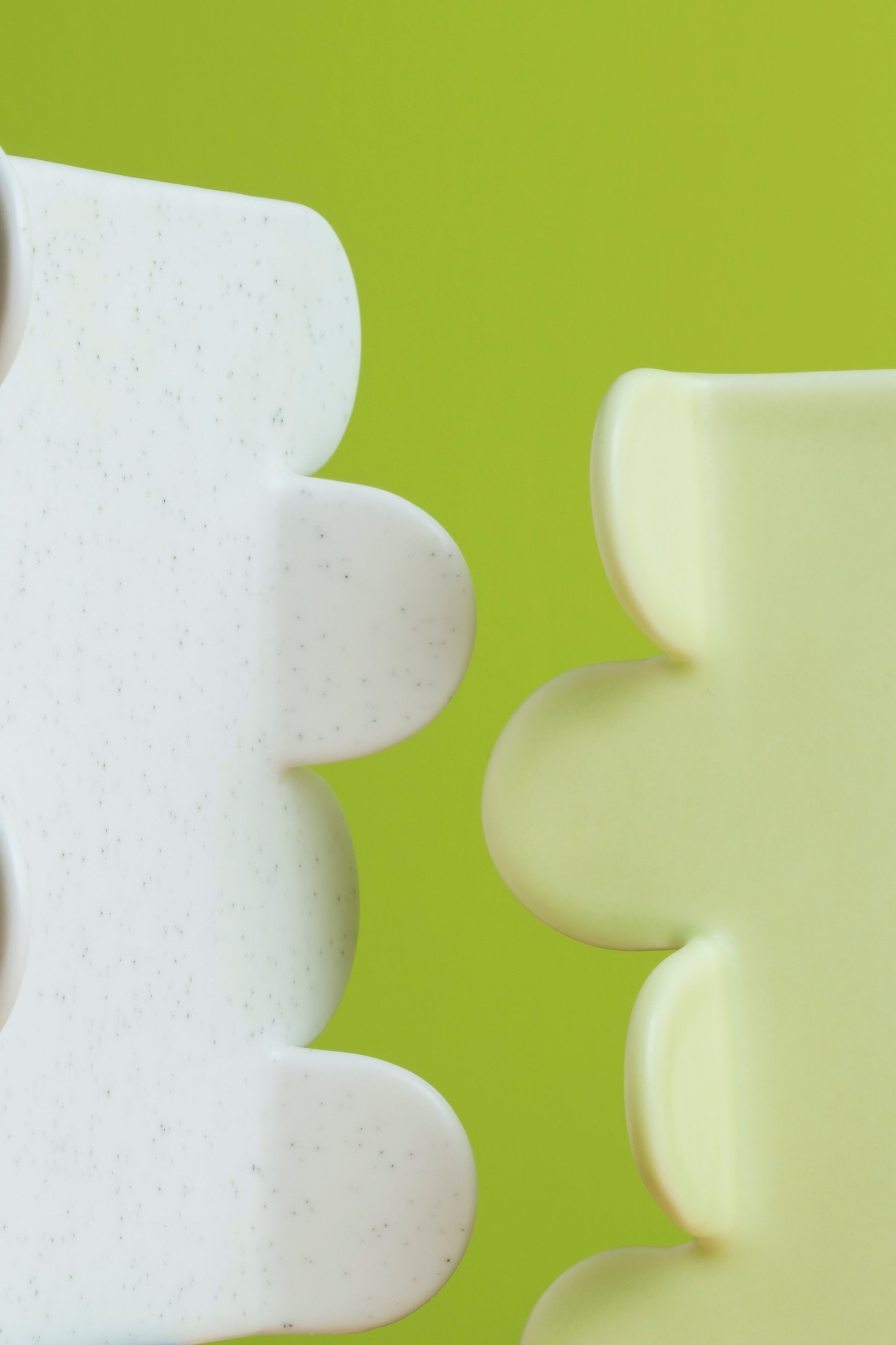 White textured objects on a green background