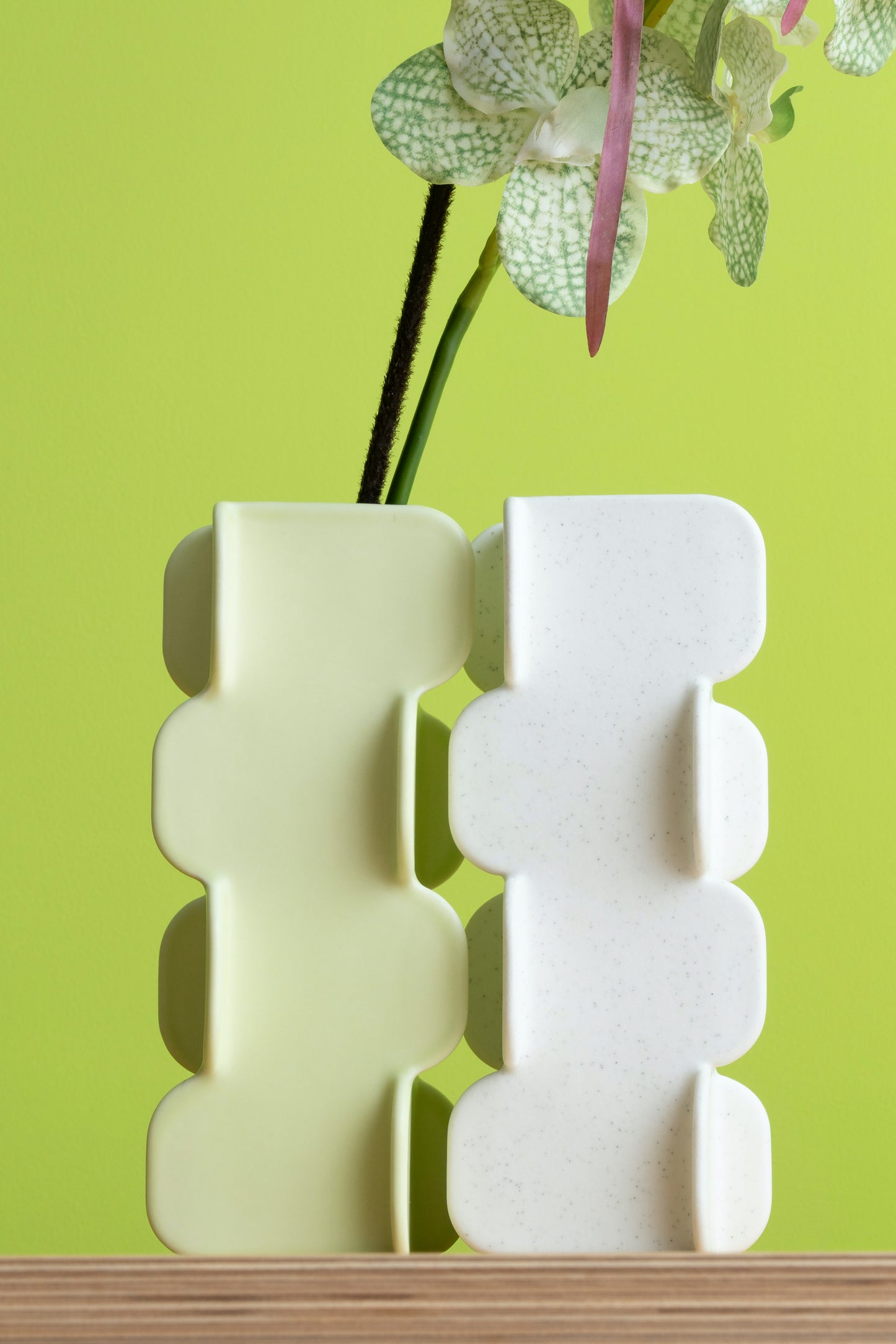 White abstract vase with a green background