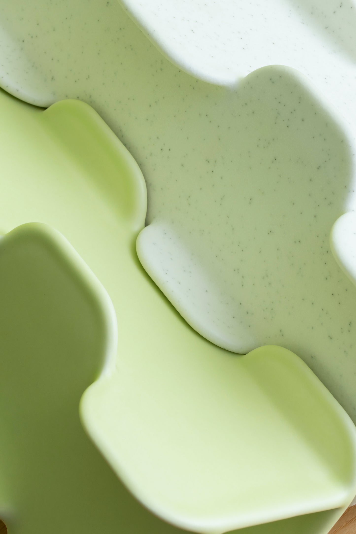 Close-up of a green foam pillow with wavy design