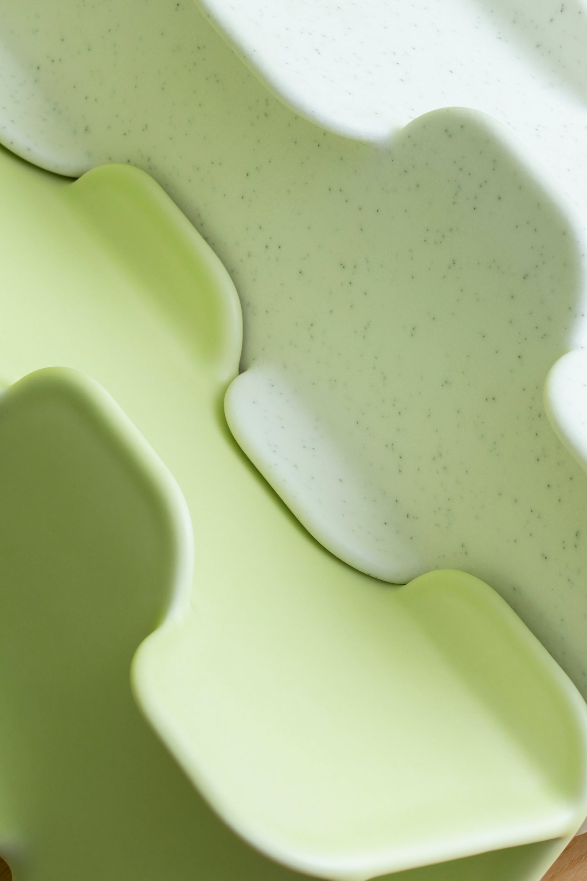 Close-up of a green foam pillow with wavy design