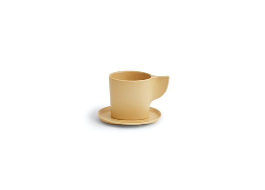 Beige ceramic cup and saucer on a white background