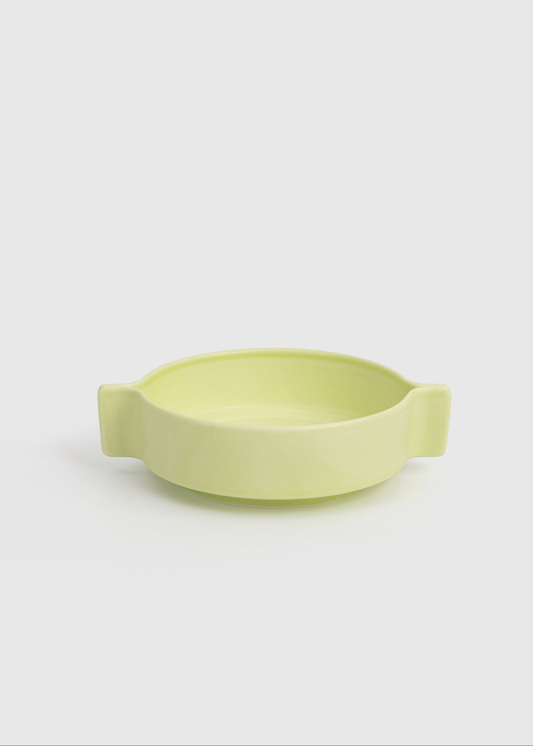 Light green ceramic bowl on a white background