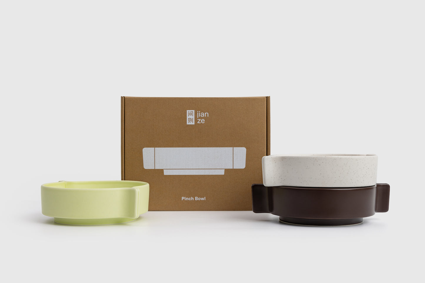 Two ceramic bowls and a box with 'lian ze' branding on a white background