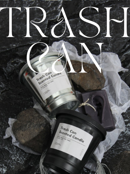 Trash can-scented candles with decorative elements on a dark background