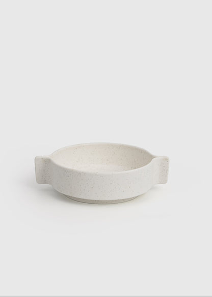 White ceramic bowl on a light gray background